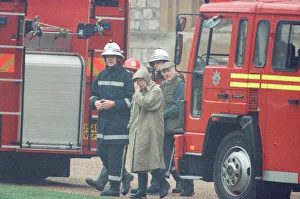 00511 Gallery: The Queen is escorted by the chief fire officer around the grounds of Windsor Castle as