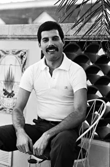 Images Dated 23rd May 2014: Queen lead singer Freddie Mercury seen here relaxing in a roof top garden in New Orleans