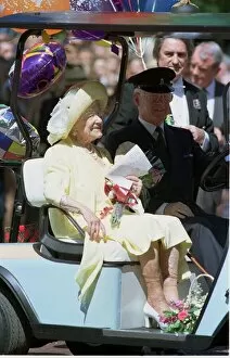 Images Dated 4th August 1999: The Queen Mother rides in her buggy outside Clarence House as Britain'