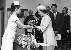 The Queen is presented with a bouquet of flowers during her visit to Walsgrave Hospital The Queen is presented with a bouquet of flowers during her visit to Walsgrave Hospital