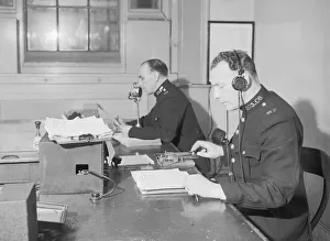 Radio and telegraph officers on duty in Scotland Yard's information room Radio and telegraph officers on duty in Scotland Yard's information room