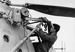 RAF ground crew member T Walton seen here checks the winch on a RAF Bristol Sycamore HR13 RAF ground crew member T Walton seen here checks the winch on a RAF Bristol Sycamore HR13