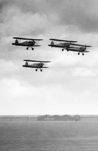 Four RAF Tiger Moth trainers flying in formation at Baginton, Coventry, West Midlands Four RAF Tiger Moth trainers flying in formation at Baginton, Coventry, West Midlands