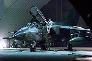 Images Dated 16th December 1998: An RAF Tornado jet being prepared for battle in the hangar at Ali Al Salem Air Base in
