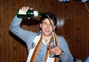 Ralph Milne pouring champagne from bottle January 1989 Ralph Milne pouring champagne from bottle January 1989