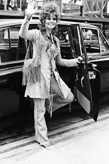 Raquel Welch Actress - May 1970 Waving as she steps into taxi after arriving Raquel Welch Actress - May 1970 Waving as she steps into taxi after arriving