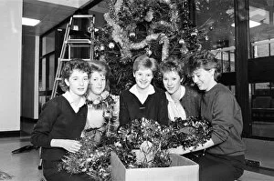Images Dated 21st December 1985: Rawthorpe High School pupils decorating the Christmas Tree in the entrance to St Luke