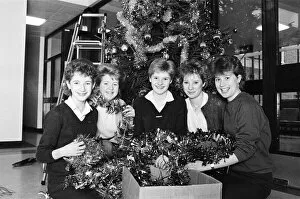 Images Dated 21st December 1985: Rawthorpe High School pupils decorating the Christmas Tree in the entrance to St Luke