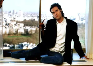 Images Dated 1st March 1990: Ray Davies The Kinks pop group singer sitting on office window ledge March 1990