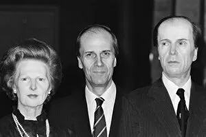 The real Norman Tebbit stands with wax works of Mrs Thatcher