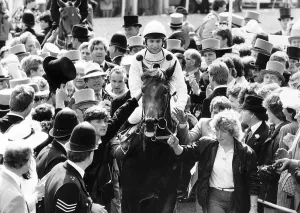 Trainers Gallery: Reference Point with jockey Steve Cauthen being escorted to the winners enclosure after