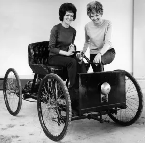 Images Dated 25th March 1971: Replica Henry Ford Quadricycle being tried out by office girls Joan Milner