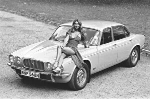 Images Dated 20th October 2010: Reveille model Marilyn Coles seen here posing with a Jaguar