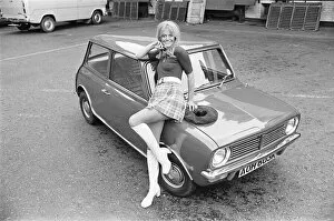 Images Dated 20th October 2010: Reveille model seen here posing with a Mini Clubman car which is a top prize in