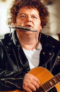 Robbie Coltrane actor playing harmonica and guitar Robbie Coltrane actor playing harmonica and guitar