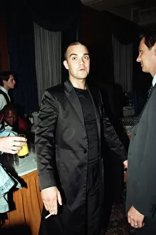 Images Dated 23rd July 1997: Robbie Williams attending the Elite Model Look of the Year competition, Connaught Rooms
