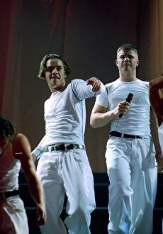 Images Dated 20th July 1993: Robbie Williams and Gary Barlow of Take That on stage at their concert in Manchester