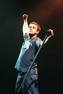 Images Dated 11th February 1999: Robbie Williams singer on stage in Glasgow