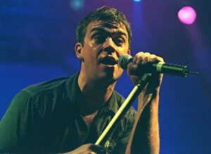 Images Dated 11th February 1999: Robbie Williams sings at his concert at the SECC Glasgow February 1999