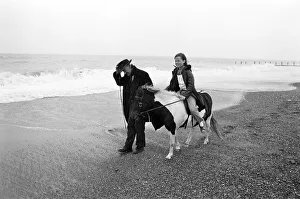 East Yorkshire Gallery: Robert Jackson pony ride owner takes Elizabeth Hood for a ride along a blustery beach at