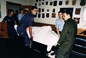 Robert Maxwell's body being carried on a stretcher Robert Maxwell's body being carried on a stretcher
