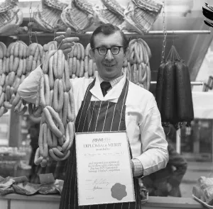 Robert Thompson Dix in his North Tyneside shop holds a string of sausages Robert Thompson Dix in his North Tyneside shop holds a string of sausages
