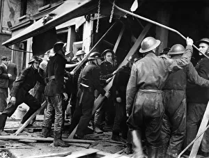 Robot Plane damage at East Lane, Walworth. Firemen and helpers holding up the floor of Robot Plane damage at East Lane, Walworth. Firemen and helpers holding up the floor of