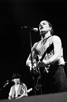 Images Dated 3rd June 1987: Rock group U2 performing on stage at the National Exhibition Centre in Birmingham