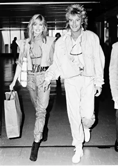00054 Gallery: Rod Stewart Rock Singer Songwriter at Heathrow with his girlfriend Kelly Emberg