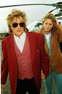 Images Dated 22nd March 1991: Rod Stewart Rock Singer with his wife Rachel Hunter