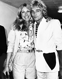 00054 Gallery: Rod Stewart Singer with girlfriend Alina at London Airport