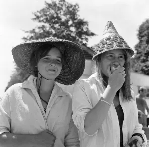 Roehampton swimming pool, London. These two young women with continental straw hats are Roehampton swimming pool, London. These two young women with continental straw hats are