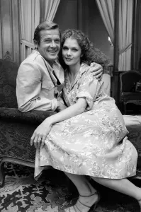 Roger Moore with actress Lois Chiles at a photocall and reception held in Paris to Roger Moore with actress Lois Chiles at a photocall and reception held in Paris to