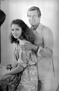 Roger Moore with actress Lois Chiles at a photocall and reception held in Paris to Roger Moore with actress Lois Chiles at a photocall and reception held in Paris to