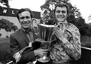 Images Dated 21st May 1971: Ron Harris and Keith Weller of Chelsea hold the trophy aboard sn open top bus on a