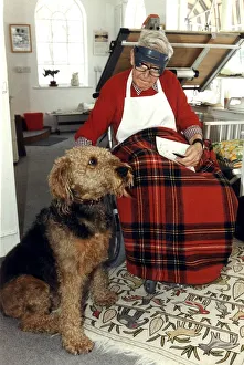 Ronald Carl Giles - Daily Express cartoonist at home in his studio with his dog Butch Ronald Carl Giles - Daily Express cartoonist at home in his studio with his dog Butch