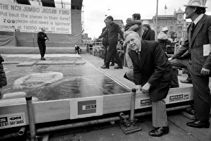 Ross McWhirter at the NCH giant jig saw campaign in Trafalgar Square March 1975