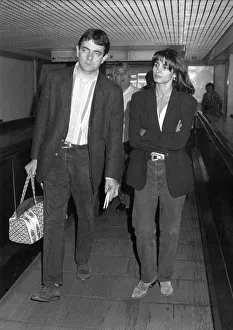 Images Dated 9th July 1992: Rowan Atkinson leaving Heathrow Airport with girl. July 1992 P016999
