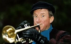Roy Castle TV Presenter and Entertainer plays a trumpet to celebrate his OBE honours in