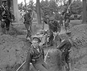 Royal Marines handing out tins of Bully Beef at the earthwork defences Royal Marines handing out tins of Bully Beef at the earthwork defences