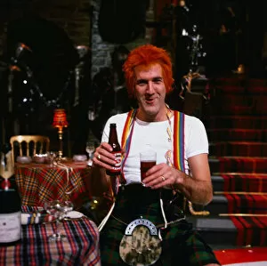 Images Dated 1st November 1994: Russ Abbot comedian November 1994 dressed as Jimmy wearing kilt holding bottle of beer