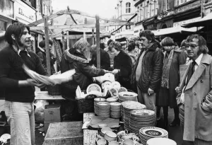 Salesman rattling plates during his sales pitch at Pontypridd 25th November 1976 Salesman rattling plates during his sales pitch at Pontypridd 25th November 1976