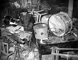 00479 Gallery: Salvage workers sort through the damaged band instruments at the Cafe de Paris following