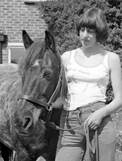 Images Dated 29th May 1977: Sam the pet pony with his owner in the garden at his home in Woodingdean