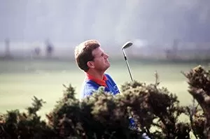Sandy Lyle standing in rough looking up October 1988