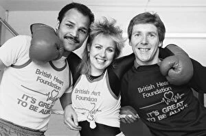 Images Dated 2nd April 1984: Saturday presenter Sarah Green, helped put John Conteh (left