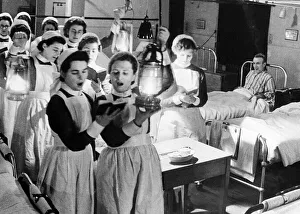 Scene at Westminister Hospital on Christmas Eve - 1940 Nurses walk through wards Scene at Westminister Hospital on Christmas Eve - 1940 Nurses walk through wards