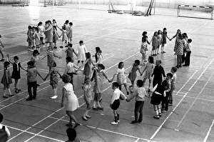 School children take part in an end of school year dance at the Lightfoot Stadium in School children take part in an end of school year dance at the Lightfoot Stadium in