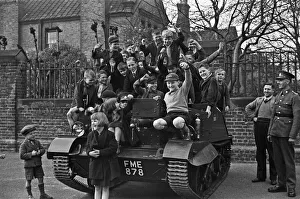 Schoolchildren clamber over a Bren Gun Carrier of the 2nd Battalion East Surrey Regiment Schoolchildren clamber over a Bren Gun Carrier of the 2nd Battalion East Surrey Regiment