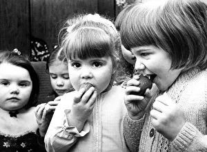 Some schoolchildren eating mini Easter eggs in 1975 Some schoolchildren eating mini Easter eggs in 1975